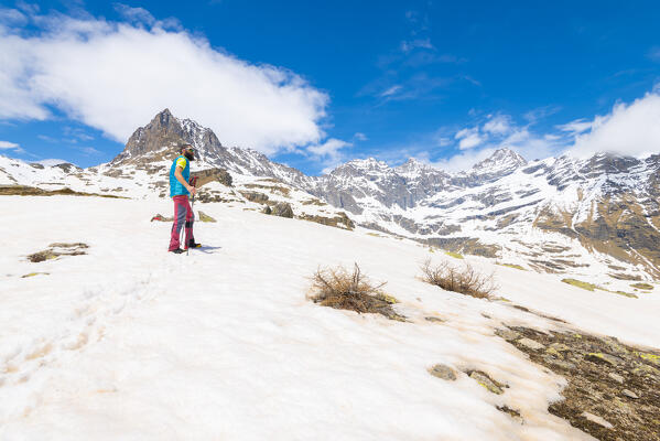 Hiker at Colle Sia, Orco valley, Gran Paradiso National Park, Canavese, province of Turin, Piedmont, Italy