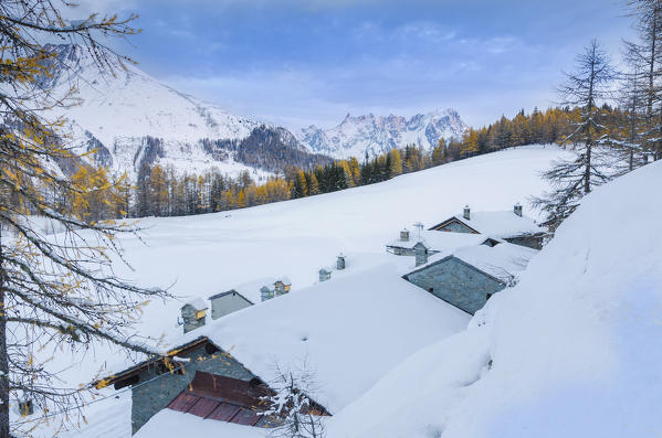 The little village of Petosan, with Grandes Jorasses in the background (La Thuile Valley, Aosta Valley, Italy, Italian alps)