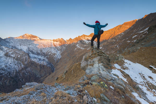 Alpinist seeing the sunrise, Valle Soana, Gran Paradiso National Park, Piedmont, Italy, Italian alps