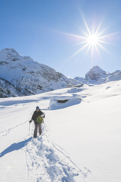 Hiker in Rhemes Valley, Gran Paradiso National Park, Aosta Valley, Italian alps, Italy
