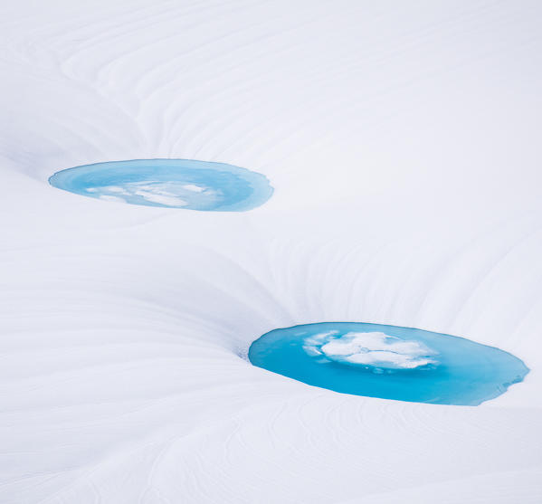 two ponds on the surface of the Forni glacier, Valtellina, Italy, Alps