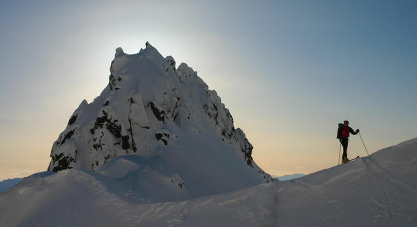 Skier on a ridge, Geitgalien, Lofoten, Norway