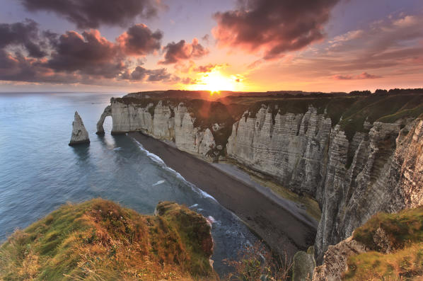 Sunrise over the cliff of Etretat in Normandy, France.