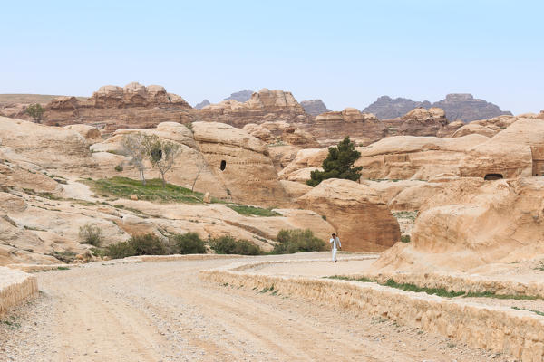 Tourist exploring the ruins of ancient Petra, Jordan