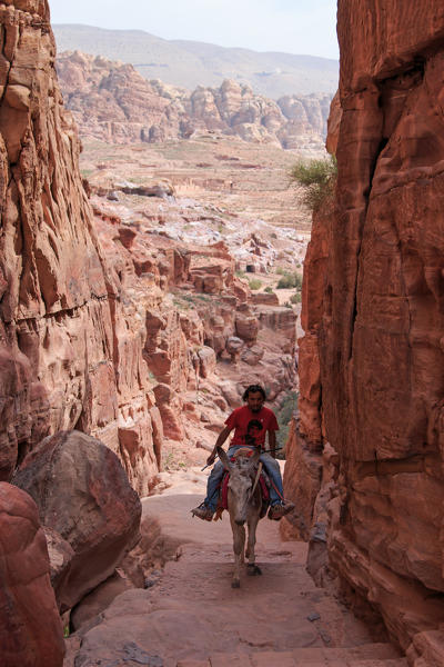 Local Jordanin guide exploring the ruins of ancient Petra, Jordan