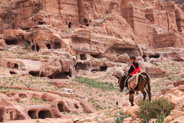 Local Jordanin guide exploring the ruins of ancient Petra, Jordan