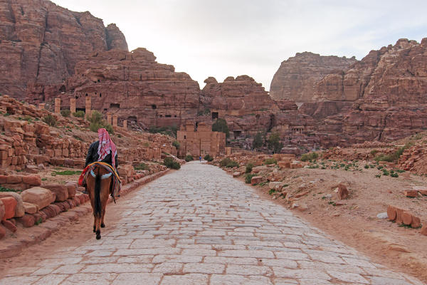 Tourist exploring the ruins of ancient Petra, Jordan