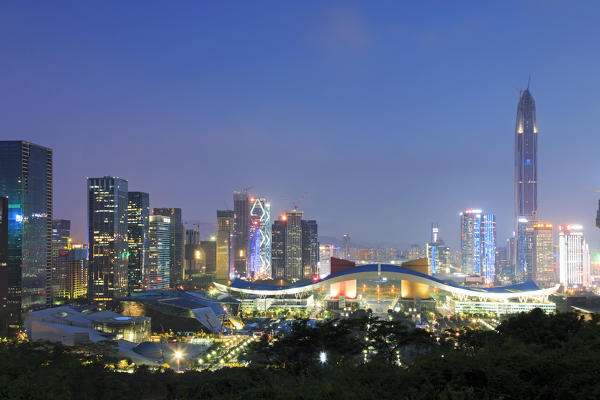 Shenzhen cityscape at dusk with the Civic Center and the Ping An IFC on foreground, China