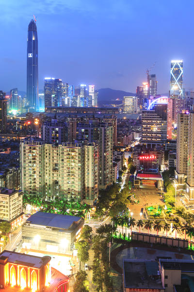 Shenzhen skyline at twilight with the tallest building of the city on background: the Ping An IFC, China