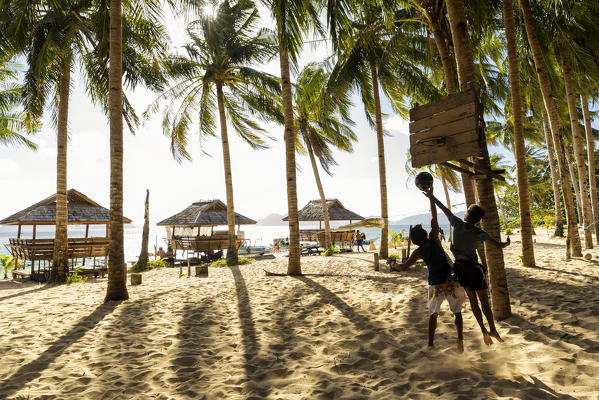 Playing basketball in Seven Commando Beach, El Nido, Palawan, Philippines