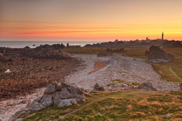 Ouessant island, Bretagne, France. A sunrise in the most westerly point of Ouessant island. In backgroud this is the Creac'h lighthouse