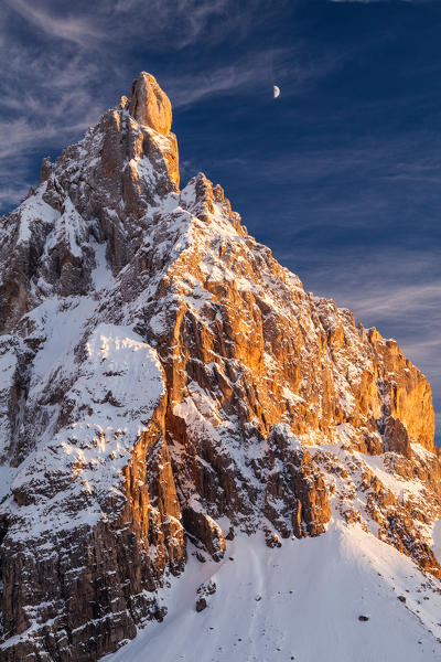 Cimon della Pala, Dolomites, Trentino Alto Adige, Italy. Winter sunset with moon