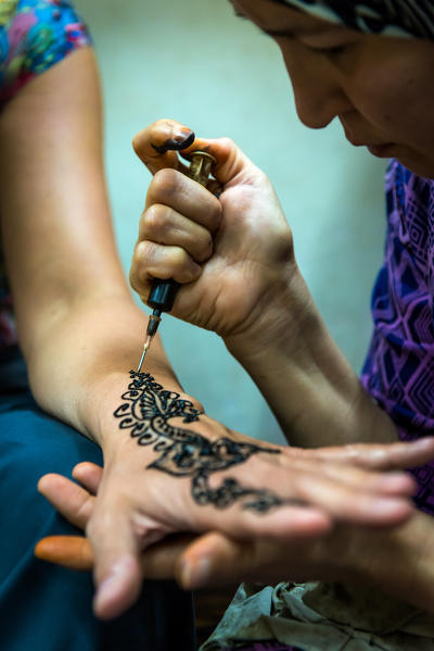 Fes, Marocco, North Africa. Henna tattoo on hand for a tourist.
