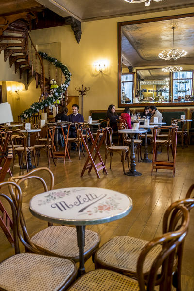 Ascoli Piceno, Marche, Central Italy, Europe. Customers inside the historic Caffè Meletti.