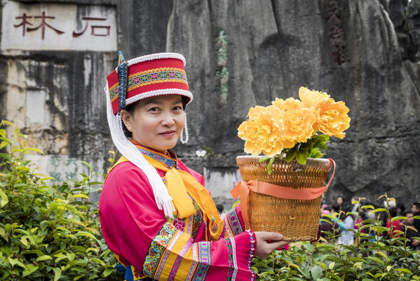 Sani minority girl with traditional dress at Stone Forest or Shilin, Kunming, Yunnan Province, China, Asia, Asian, East Asia, Far East