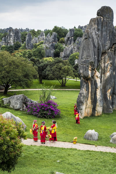 Sani minority girls with traditional dress at Stone Forest or Shilin, Kunming, Yunnan Province, China, Asia, Asian, East Asia, Far East