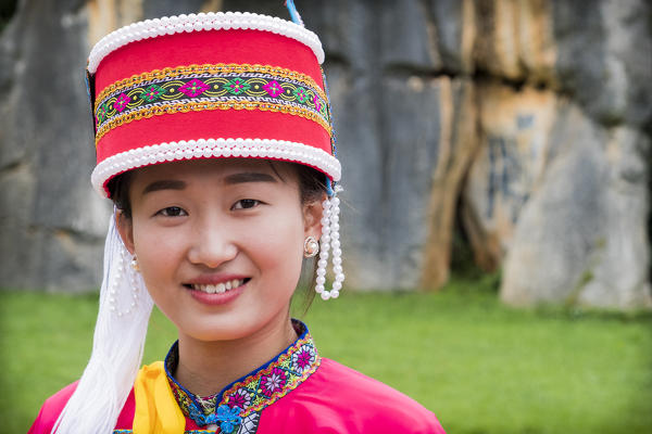 Sani minority girl with traditional dress at Stone Forest or Shilin, Kunming, Yunnan Province, China, Asia, Asian, East Asia, Far East