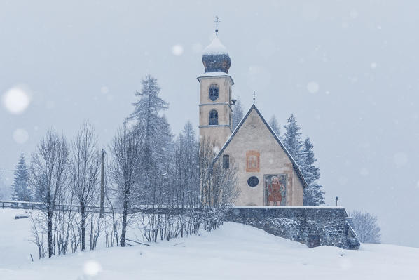 The ancient gothic church of Santa Fosca in winter, Selva di Cadore, Belluno, Veneto, Italy