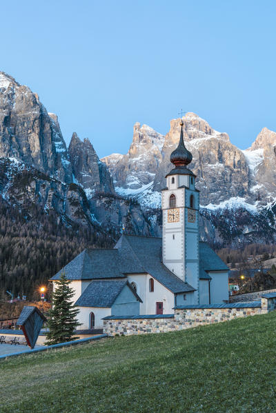 Colfosco, Alta Badia, Dolomites, South Tyrol, Italy. The church San Vigilio with the Sella group in background