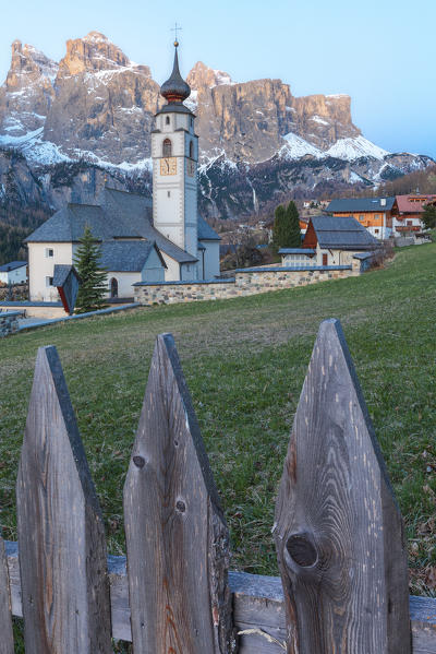 Colfosco, Alta Badia, Dolomites, South Tyrol, Italy. The church San Vigilio with the Sella group in background