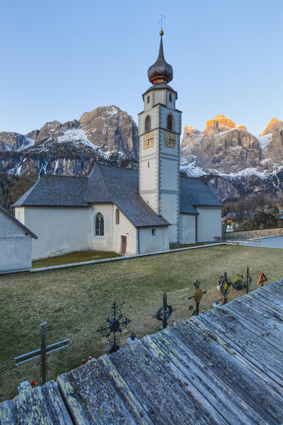Colfosco, Alta Badia, Dolomites, South Tyrol, Italy. The church San Vigilio with the Sella group in background