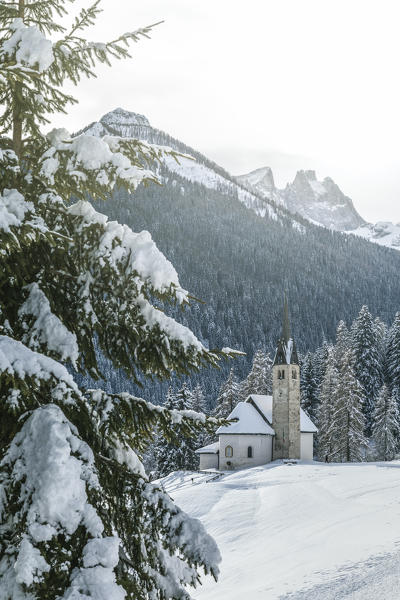 Blessed Virgin of Health church in winter, Caviola, municipality of Falcade, Biois valley, Belluno, Veneto, Italy