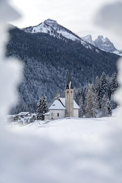 Blessed Virgin of Health church in winter, Caviola, municipality of Falcade, Biois valley, Belluno, Veneto, Italy