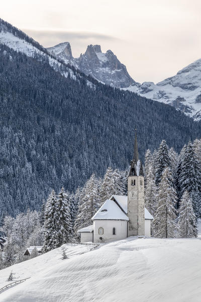 Blessed Virgin of Health church in winter, Caviola, municipality of Falcade, Biois valley, Belluno, Veneto, Italy