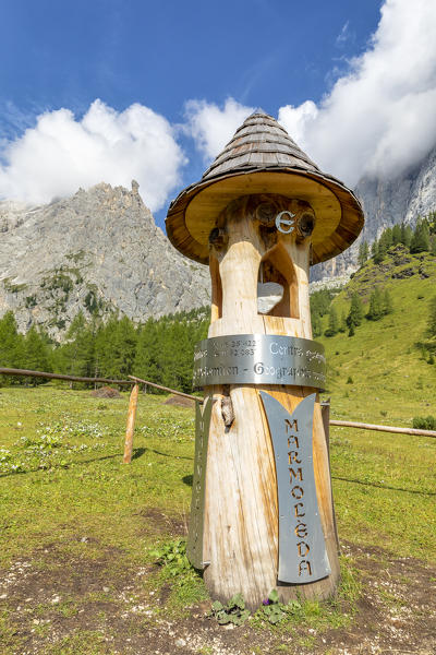 the totem representing the geographical center of the Dolomites, in the Ombretta valley at the foot of the Marmolada, Rocca Pietore, Belluno, Veneto, Italy
