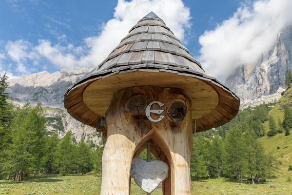 the totem representing the geographical center of the Dolomites, in the Ombretta valley at the foot of the Marmolada, Rocca Pietore, Belluno, Veneto, Italy
