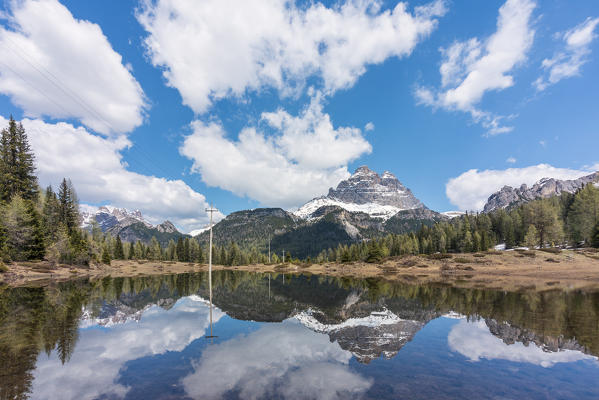 Tre Cime di Lavaredo reflected in an ephemeral lake at the thaw, dolomites, auronzo di cadore, belluno, veneto