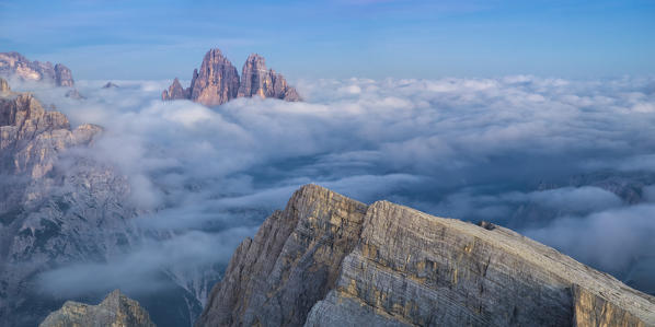 Tre Cime di Lavaredo emerging from the sea of clouds, Sexten Dolomites, South Tyrol, Bolzano, Italy, Europe