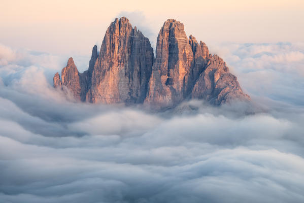 Tre Cime di Lavaredo emerging from the clouds, Sexten Dolomites, South Tyrol, Bolzano, Italy, Europe