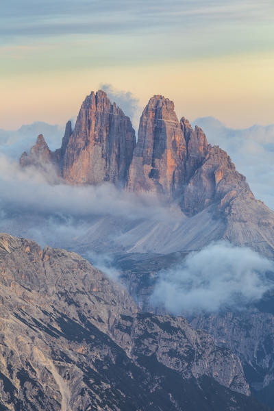 Tre Cime di Lavaredo emerging from the sea of clouds, Sexten Dolomites, South Tyrol, Bolzano, Italy, Europe