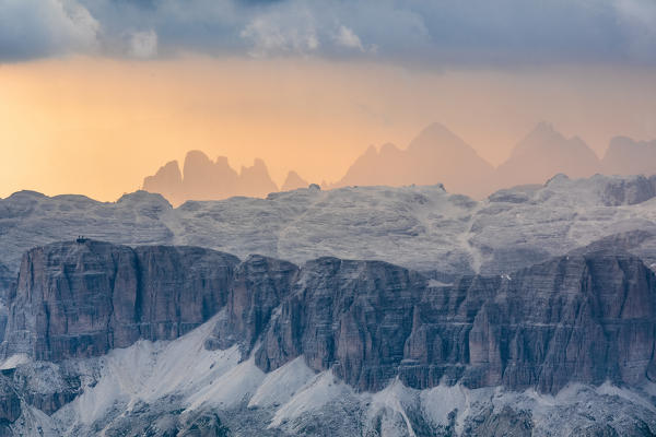 The Sella group seen from Marmolada at sunset, on the backgound in silhouette from the left the Gran Fermeda,  Sass Rigais and Furchetta in the Geislergruppe, Dolomites, South Tyrol, Italy