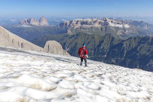 mountaineer on the schena del mul, punta penia, marmolada glacier, Trentino alto Adige, Dolomites, Italy