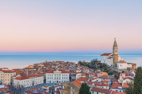 Twilight on the historic town of Piran with the church of St. George, Primorska, Istria, Slovenia