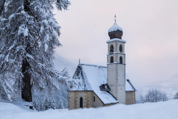 the ancient church of santa fosca in selva di cadore, winter landscape, dolomites, belluno, veneto, italy