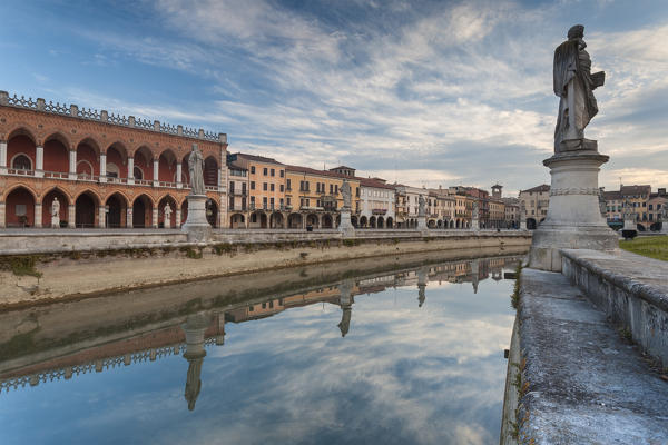 Europe, Italy, Veneto, Padua. Buildings reflected in the canal around Prato della Valle