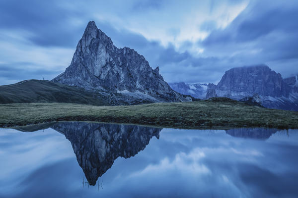 Ra Gusela reflected in an alpine pond, Dolomites, Cortina d'Ampezzo,, Belluno, Veneto, Italy