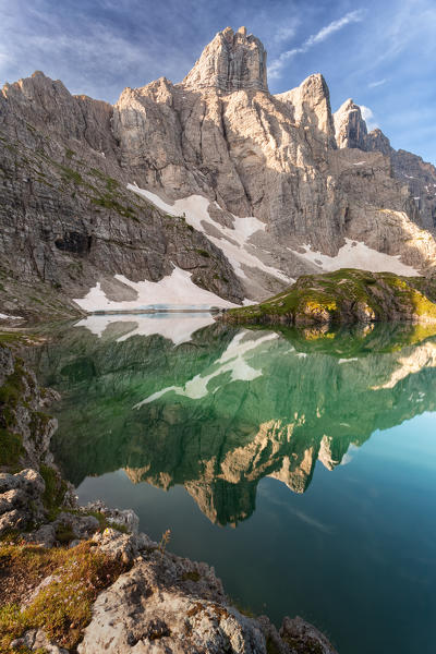 Europe, Italy, Veneto, Belluno. Lake of Coldai, the towers of mount Civetta are reflected in the water, Dolomites