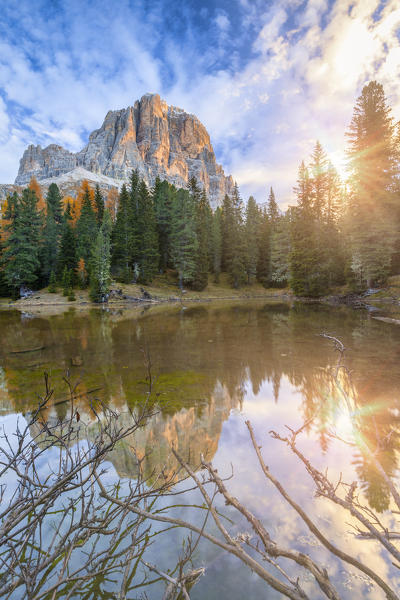the small lake of Bain de Dones in autumn, in the background the Tofana di Rozes reflected in the water surface, Dolomites, Cortina d'Ampezzo, Belluno, Veneto, Italy