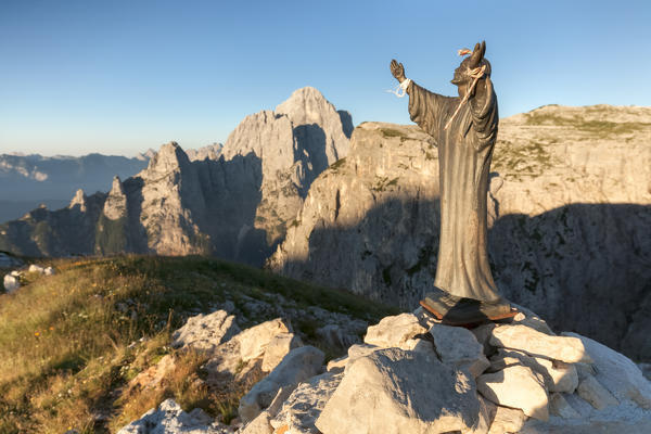 Statue of Christ near the bivouac M. Bedin on First Pala di San Lucano, in the background Mount Agner. Dolomites Agordino, Belluno, Veneto, Italy, Europe