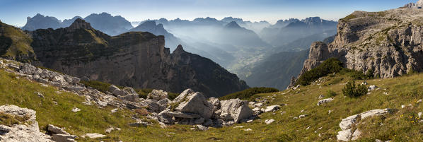 Wide view on the First and Second Pala di San Lucano, Dolomites. On the background on a succession of summits from Civetta, Moiazza until Schiara and Monti del Sole. Agordino, Belluno, Veneto, Italy, Europe