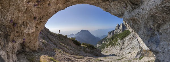 Europe, Italy, Veneto, Belluno. Natural cave on the Sasso di Scarnia, Dolomites, Belluno Dolomiti National Park, Vette Feltrine