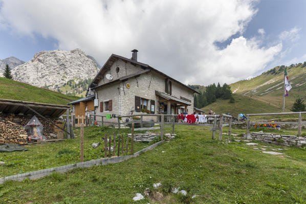 Europe, Italy, Veneto, Belluno. The Boz alpine hut, on the lawns of the Neva in the Cimonega group, Cesiomaggiore, Dolomites, Belluno Dolomiti National Park