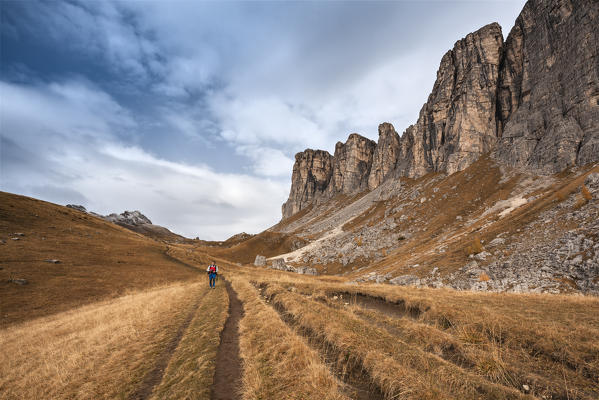 Europe, Italy, Veneto, Belluno. Hiker in the foothills of  Lastoni di Formin, Mondeval, Dolomites