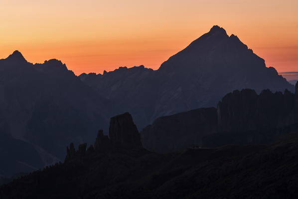 Europe, Italy, Veneto, Belluno, Cortina d Ampezzo. Silhouette of Cinque Torri, Croda da Lago e Antelao at dawn. Dolomites