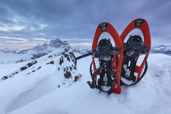 Europe, Italy, Veneto, Belluno.  Snowshoeing on the summit. In the background mount Pelmo, Mondeval, Dolomites