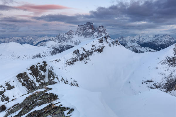 Europe, Italy, Veneto, Belluno. Winter view towards mount Mondeval, followed by the imposing mount Pelmo, Dolomites